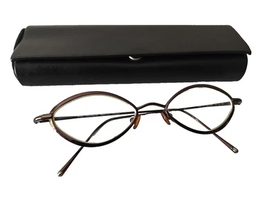 Monturas y estuche ovalados de metal púrpura ciruela Modo 773 para mujer 48-18 135 Italia Foto 1 de 4