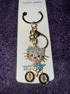 Blue Rhinestone Hello Kitty In Bicycle  - Picture 1 of 5