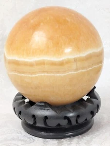Sfera di calcite a fascia arancione 700 grammi 76 mm - Foto 1 di 6