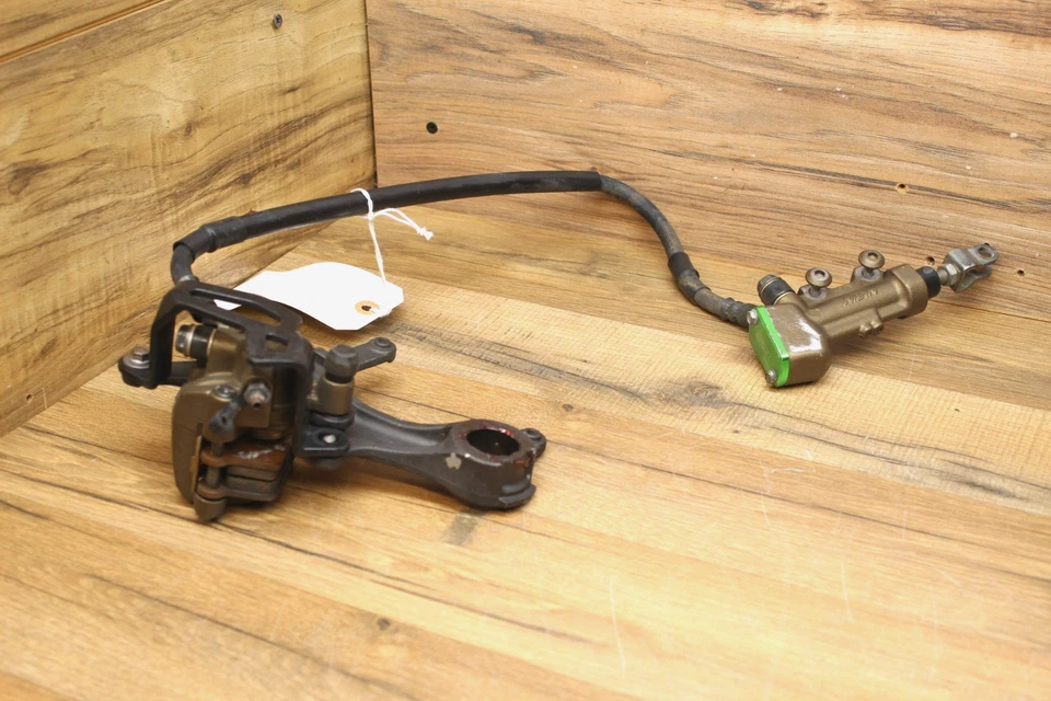 11 Kawasaki KX450 F KX 450 2011 maestro de freno trasero con pinza y suspensión Foto 1 de 4