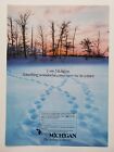 Michigan Tourism Bureau Footprints in Snow Near Forest 1986 Vintage Print Ad