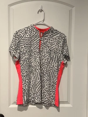 Polo de golf Tail Activewear para mujer estampado geométrico blanco y negro + acento rosa L Foto 1 de 3