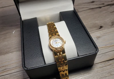 Reloj de cuarzo Jules Jurgensen vintage con bisel de cristal en tono dorado esfera ostra para dama Foto 1 de 4