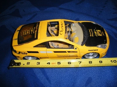 1/18 JADA IMPORT RACER TOYOTA CELICA METAL MODEL YELLOW - MISSING PARTS - Image 1 of 4