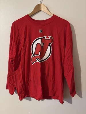 Camiseta deportiva Reebok New Jersey Devils grande Martin Brodeur manga larga para hombre Foto 1 de 4