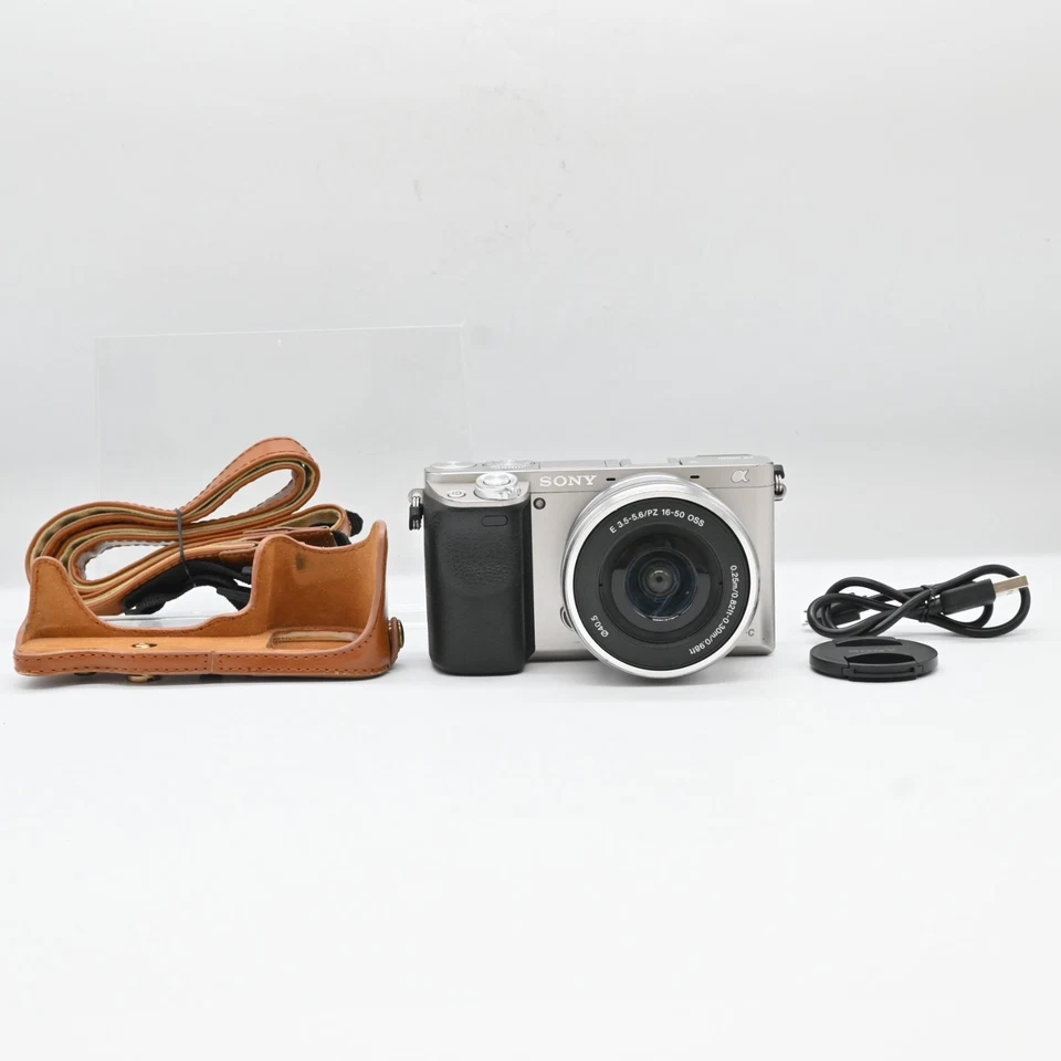 Sony Alpha A6000 (kit con zoom 16-50 mm) argento [35 lingua / Exc + 5] - Immagine 1 di 4