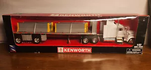NewRay Kenworth W900 Semi Tractor Trailer Hauling K-Rails 1:32 - Picture 1 of 2