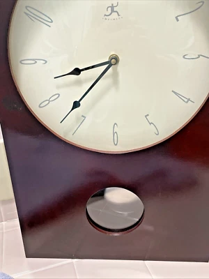 Infinity Instruments Wall Clock Battery Powered Quartz Movement With Pendulum - Image 1 of 4