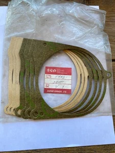New NOS Suzuki set of 7 gaskets magneto stator cover 1971-77 TS TC 125 - Bild 1 von 2