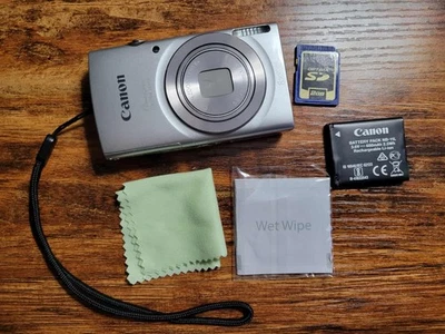 CÂMERA DIGITAL CANON PowerShot ELPH 180 8X - Funcionando com bateria, cartão SD e pano - Imagem 1 de 4