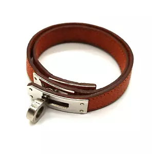 Bracciale Hermès Kelly Double Tour in pelle arancione-marrone con scatola aut... - Foto 1 di 11