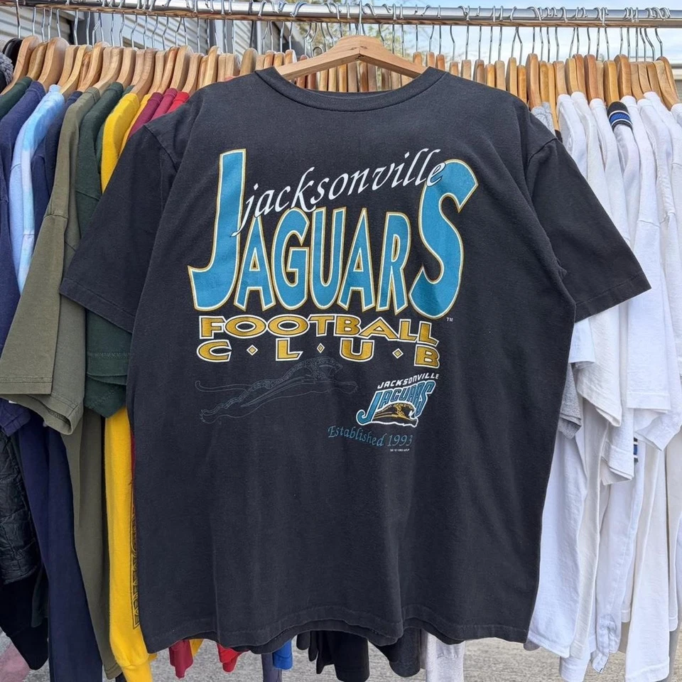 Sudadera negra de fútbol americano de los 90 Jacksonville Jaguars NFL camiseta remake HN4760 Foto 1 de 1
