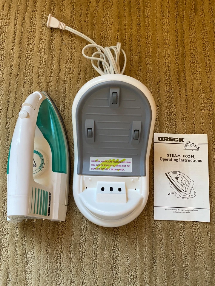 Plancha de vapor inalámbrica Oreck TX850 con base de alimentación giratoria | Plancha de velocidad - Apenas usada Foto 1 de 4