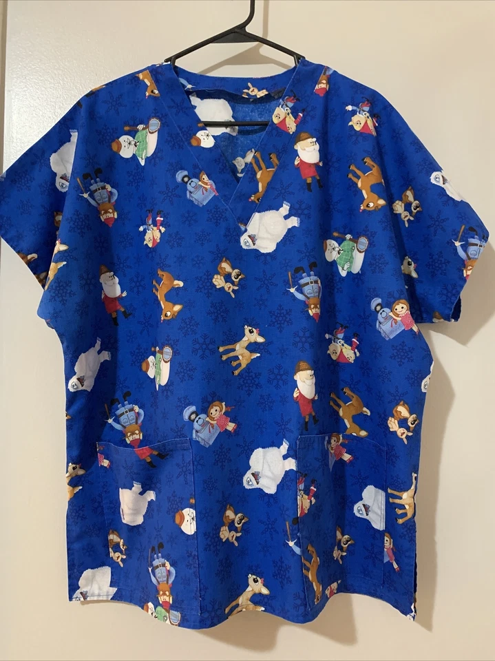 UNIFORME EXFOLIANTE TOP RUDOLPH & FRIENDS 2XL Hecho a Mano Azul Mangas Cortas Usado en Excelente Condición Foto 1 de 4