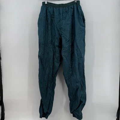 Pantalones de chándal cortavientos vintage para hombre y mujer medianos verde bosque puño con cremallera Foto 1 de 4