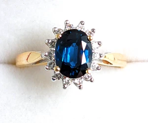 Anillo de oro amarillo de 14 quilates con halo de diamantes y zafiro azul ovalado de aproximadamente 0,14 quilates talla 8 - Imagen 1 de 12