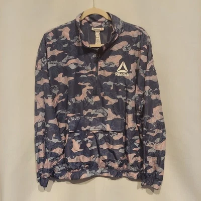Cortavientos Reebok Mujer Azul/Rosa/Gris Camuflaje Essential LS Cuarto Cremallera Talla XL Foto 1 de 4