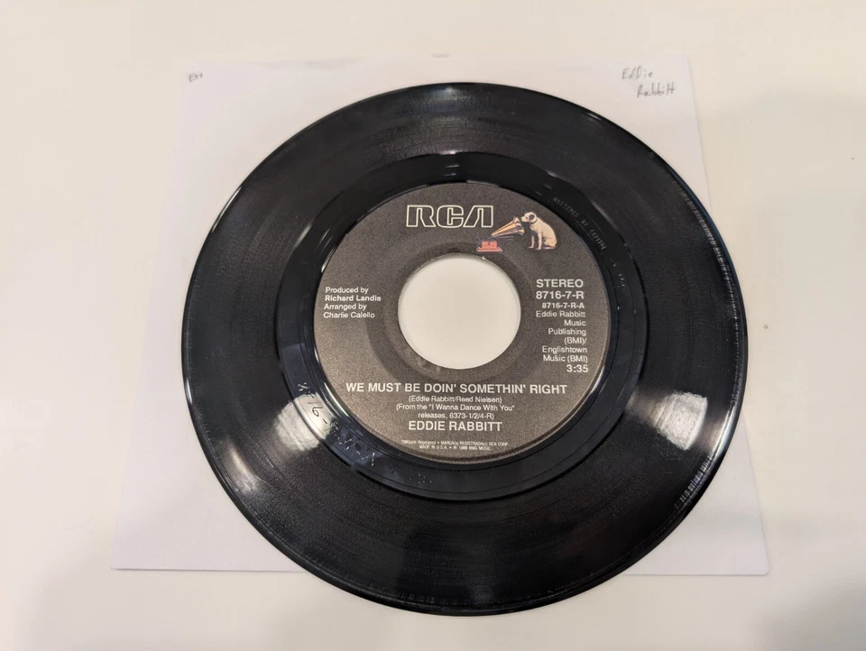 Eddie Rabbitt "We Must Be Doin' Somethin' Right / He's a Cheater" (EX+ disc) - Image 1 of 1