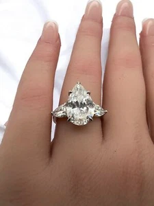 Impresionante anillo de compromiso de platino natural con canasta de 3 piedras de diamantes de pera graduados GIA - Imagen 1 de 10