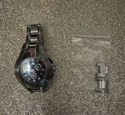 Reloj Hombre Adidas Vintage ADP1132 Plateado Negro Cara Necesita Batería Foto 1 de 4