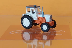Busch 51354 Belarus MTS-52 Export hellbeige / rot 1:87 NEU Modellauto - Bild 1 von 2