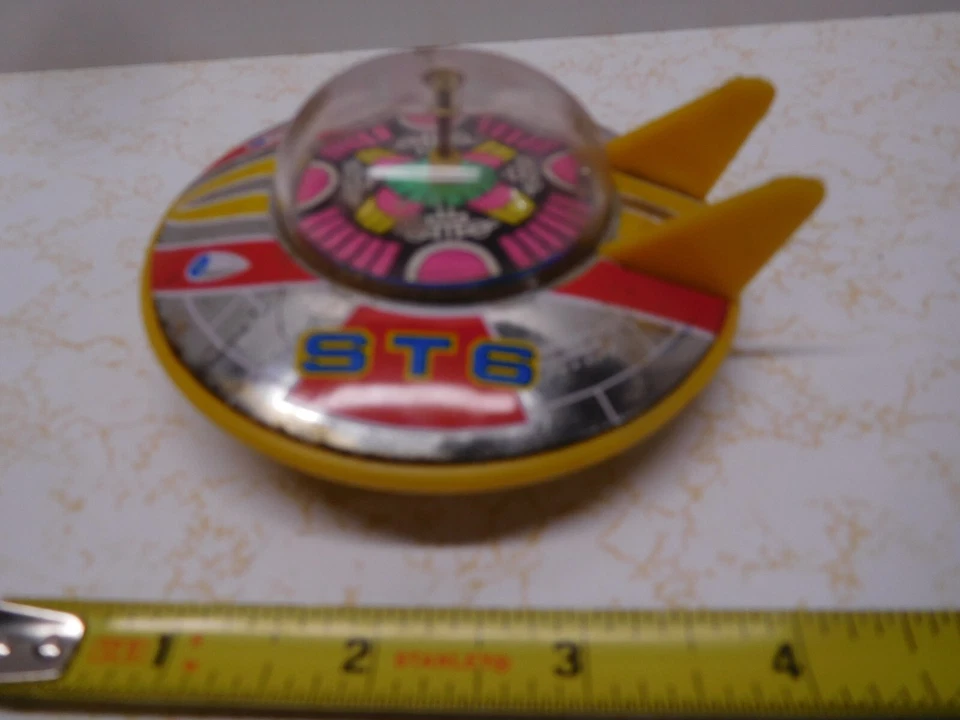 Vintage 4 inch Made in Japan ST-6 UFO Alien Plastic Toy w/Wheels & Spinning Disc - Image 1 of 4