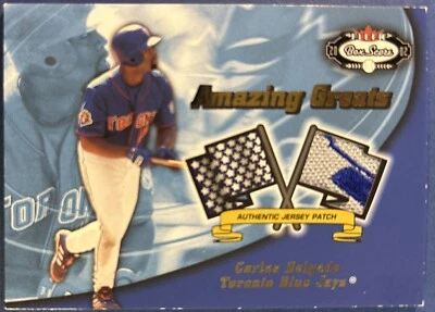 Parche reliquia Fleer Box Score 2002 Carlos Delgado Amazing Greats S# 130/150 Foto 1 de 2