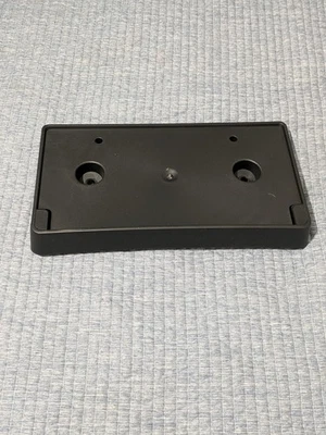 15-18 DODGE RAM 1500 LICENSE PLATE BRACKET HOLDER GENUINE MOPAR #68247750AA - Image 1 of 3