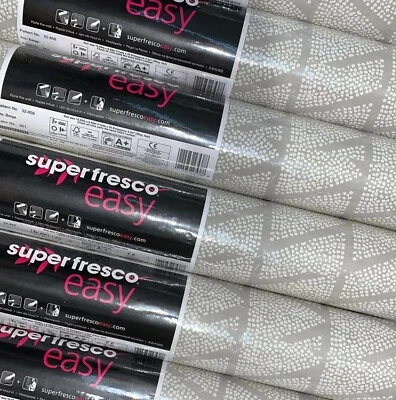 6 rollos de papel pintado Graham & Brown Kia beige triángulo blanco textura elevada puntos Foto 1 de 2