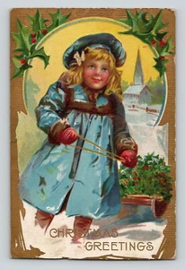 Tarjeta postal dividida de saludo de Navidad joven rubia tirando de un trineo sin publicar - Imagen 1 de 2
