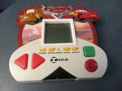 ZIZZLE DISNEY PIXAR CARS 2006 JUEGO ELECTRÓNICO PORTÁTIL ¡FUNCIONA!! Foto 1 de 4