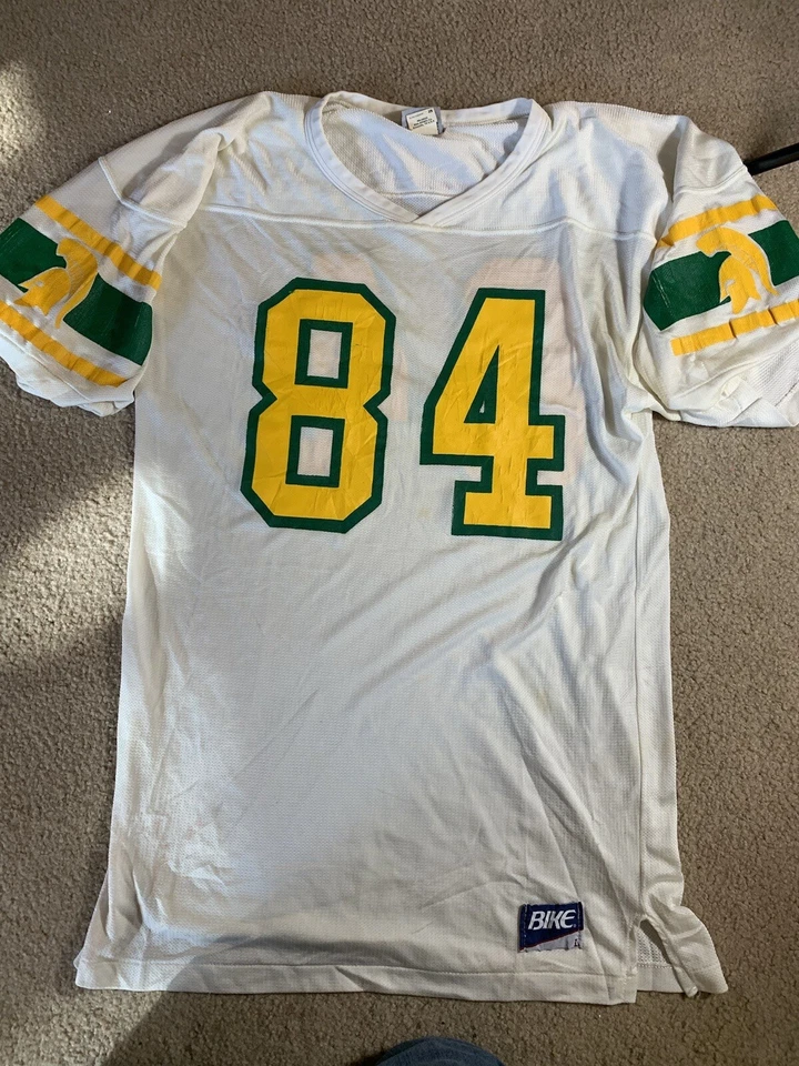 Camiseta deportiva de fútbol americano vintage rara BIKE ATLETICA dorada blanca Spartans para hombre talla L Foto 1 de 4