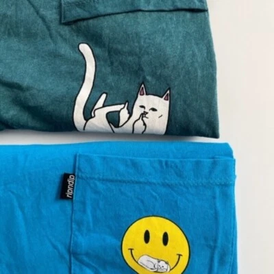 TWO Rip N Dip short sleeve t- shirts in green and blue with Lord Nermal kittys.  - Image 1 of 4