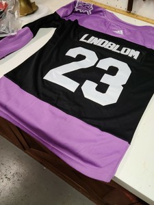 flyers purple and black jersey