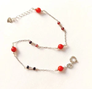 Bracciale in argento 925 con corallo bambu rosso, ematite e zirconia cubica - Foto 1 di 4