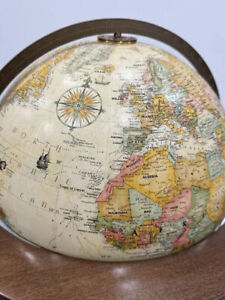"Classic Elegance: Vintage Replogle World Globe on Wooden Stand"
