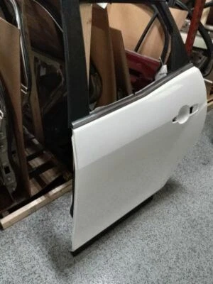 Mazda CX-7 2009 montaje puerta trasera izquierda Foto 1 de 4