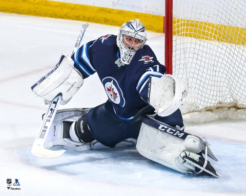 Connor Hellebuyck Winnipeg Jets Unsigned Blue Jersey Glove Save Photograph Cover