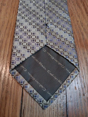 Corbata de seda Calvin Klein dorada azul negro blanco diseño geométrico elegante corbata Foto 1 de 4