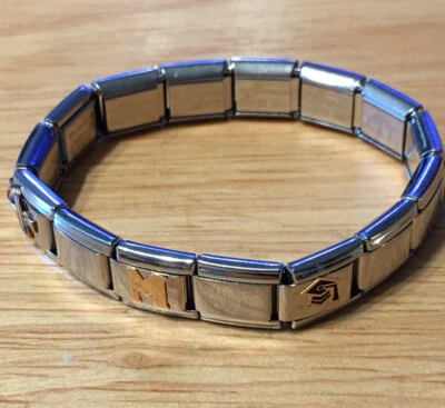 Pulsera Zoppini Italiana RE Lorence Oro 18k y S. Acero Eslabones Elásticos 4 Dijes Foto 1 de 4