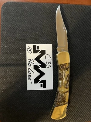 Cuchillo Plegable Buck 110 (3 Puntos) Cono de Pino con Funda de Cuero Foto 1 de 4