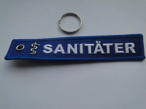 Schlüsselanhänger/Key-ring  Sanitäter  ca 13x2,5, cm  - Picture 1 of 1