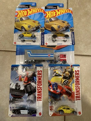 Hot Wheels Optimus Prime Transformers Track Fleet and (3) 2024 Gold Bumblebee - Image 1 of 4