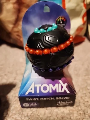 Hasbro Gaming Atomix Game for Kids Teens and Adults Brainteaser New Game Night - Image 1 of 4
