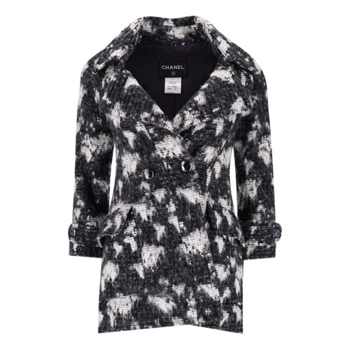 Cappotto tweed Chanel globalizzazione