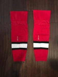 Firstar 27" Intermediate/Junioren rot & schwarz Hockeysocken. Carolina Hurricanes - Bild 1 von 3