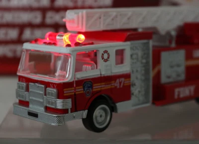 FDNY Ladder Truck #47 W/lights & Siren Pull Back Power 12"  Ladder Doors Open - Image 1 of 4