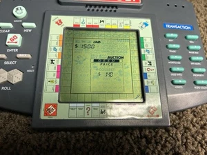 1997 Monopoly Hasbro HandHeld Electronic Talking Travel Game Tested Works - Picture 1 of 3