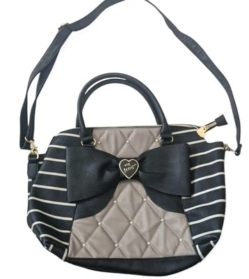 Cartera Betsey Johnson a rayas negras/bronceadas y blancas con detalles de lazo y herrajes dorados Foto 1 de 4