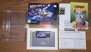 Mega Man X2 Super Nintendo SNES con insertos, sin manual con protector muy bonito - Imagen 1 de 24